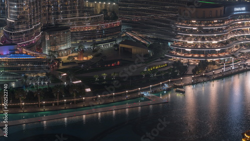 Dubai Fountain aerial night timelapse. Musical fountain, located in an artificial lake in downtown