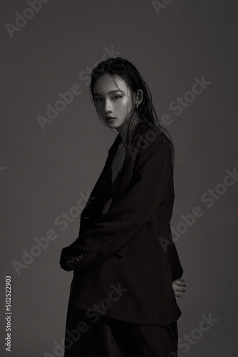 High fashion portrait of young elegant woman. Black and White image