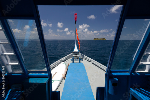 View ahead while sailing with a typical local boat in the sea of Maldives