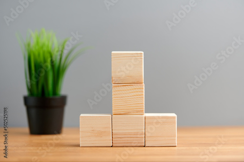 Fototapeta Naklejka Na Ścianę i Meble -  Ecology, business, seo, team, advertise concept, blank wooden block cubes on a gray background with plant for your text and advertisement. Free space for business concept template and banner..
