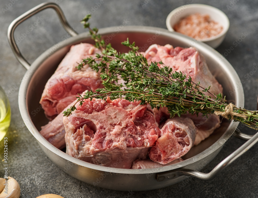 Oxtail Bones Being in Stainless Steel Skillet. Oxtail Bones Being in Stainless Steel Skillet.