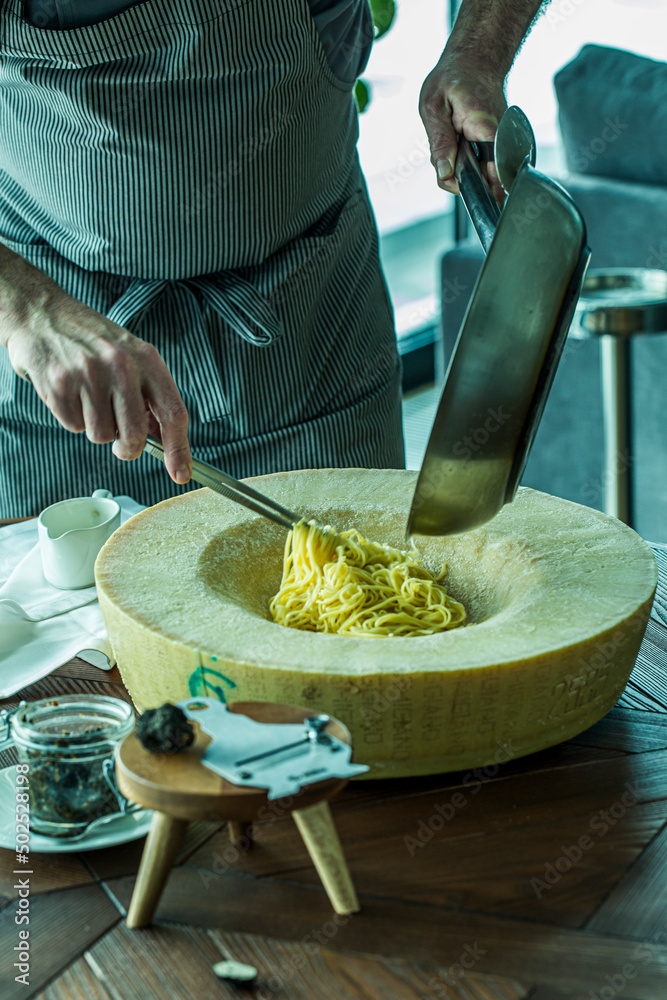 Black Truffle Pasta in Cheese Wheel Stock Photo Adobe Stock