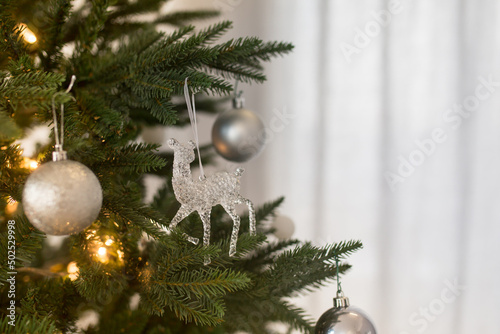 Christmas balls and toys on the Christmas tree, Christmas decorations and white decor