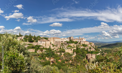 Panoramic view of Gordes forest rock and old village on Luberon massif in French Prealps. Vaucluse, Provence, Alpes, Cote d'Azur, France