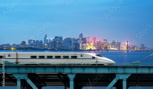High-speed rail speeds on Bridges and the modern city skyline of chongqing, China