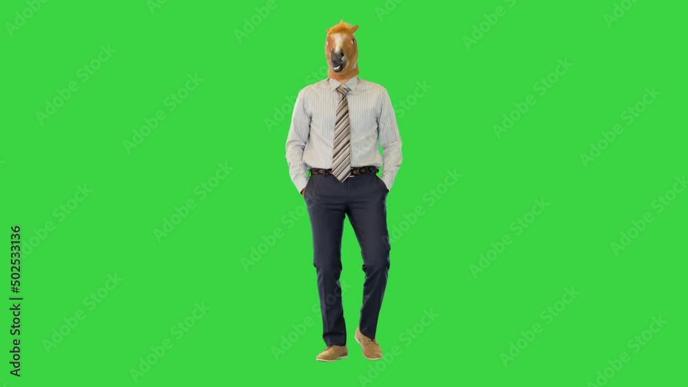 Funny businessman in formal cheering on Halloween funny walk stepping and dancing wearing horse mask on a Green Screen, Chroma Key. Funny businessman in formal cheering on Halloween funny walk stepping and dancing wearing horse mask on a Green Screen, Chroma Key.