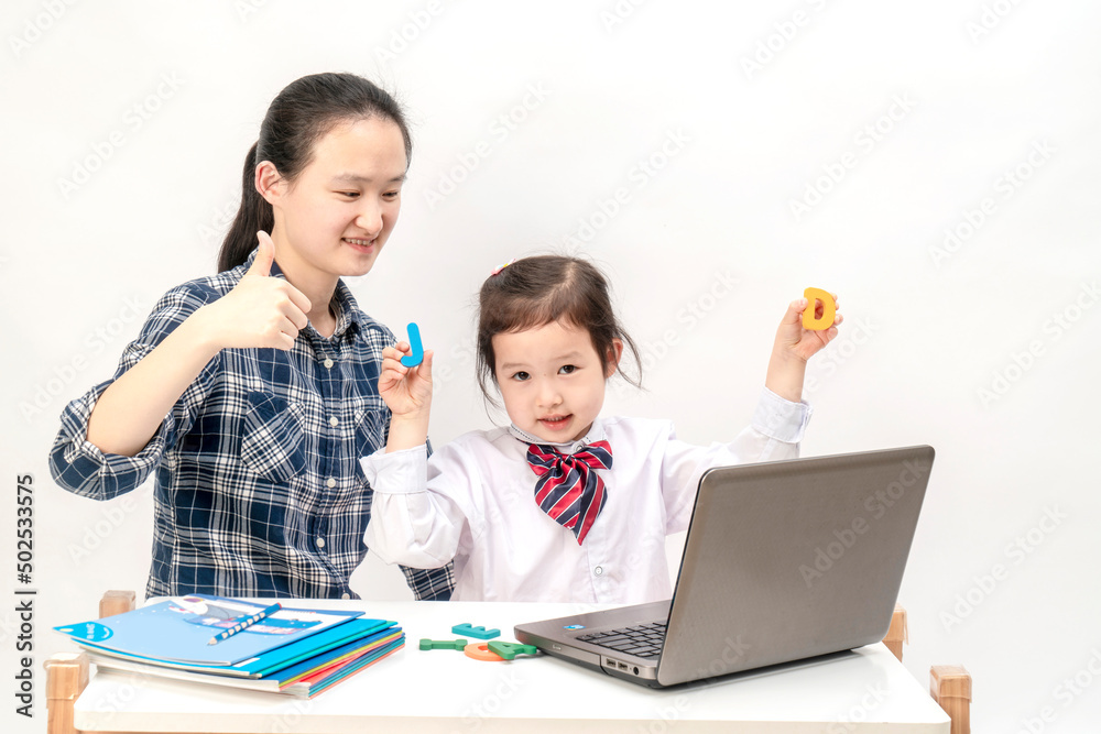 Mother and little girl are learning English letters Mother and little girl are learning English letters