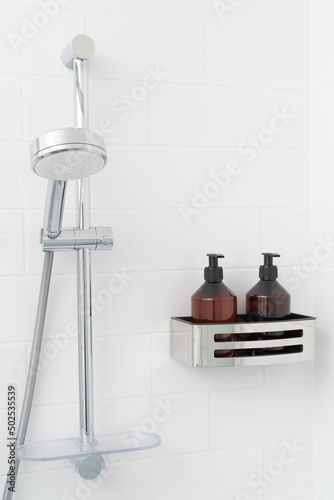 Hanging shower head, shampoo and shower gel in brown bottles on bathroom shelf.