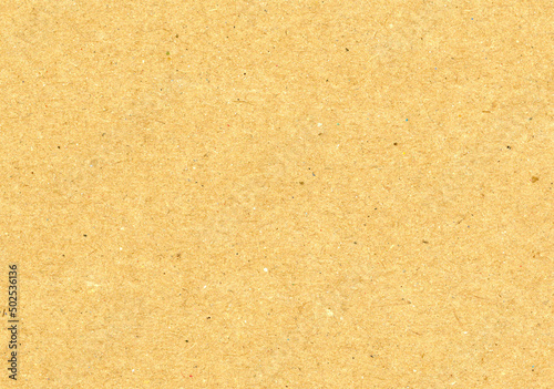 Very large close up scan image of light caramel brown uncoated kraft paper texture recycled rough fiber grain background for presentation wallpaper with copy space for text or material mockups