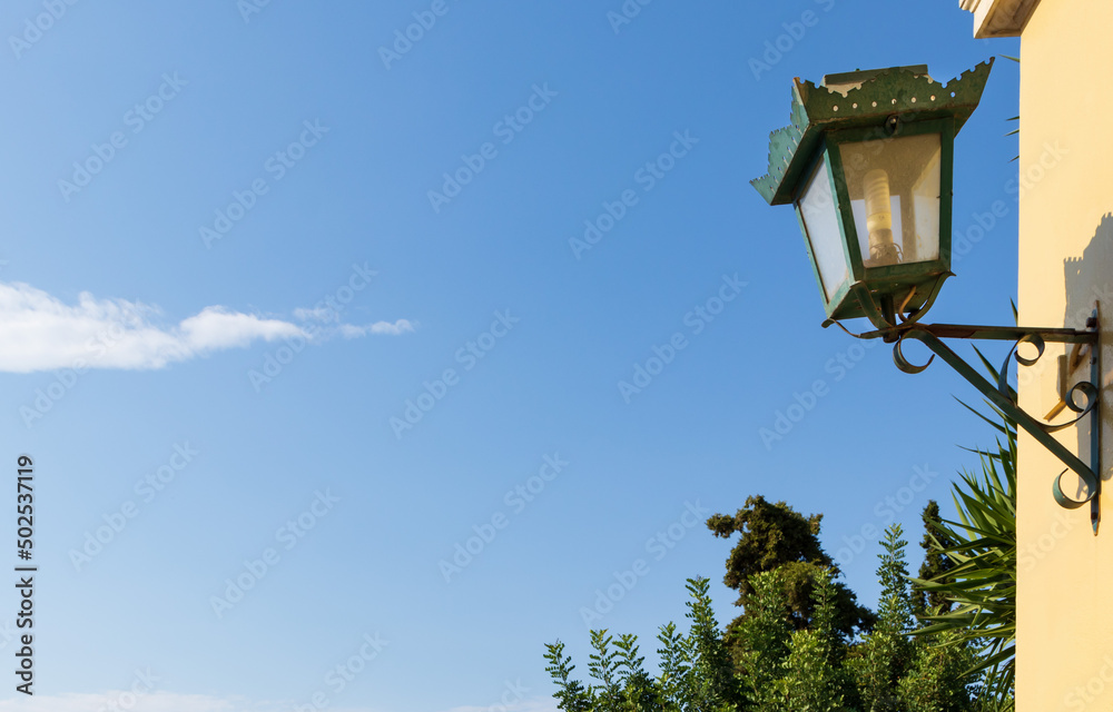 vintage lamp on the street in Athens and background is blue sky