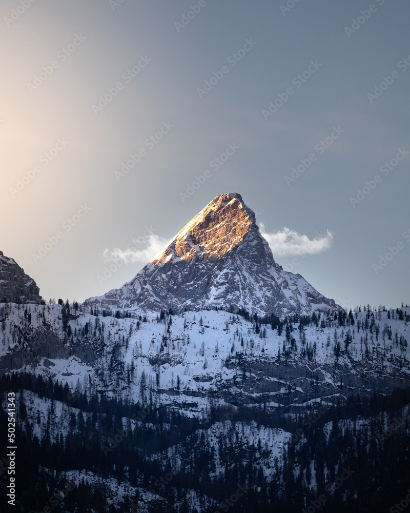 Mountain with clouds and snow during sunrise in Berchtesgaden