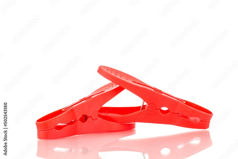 Two plastic clothespins, macro, isolated on a white background. Two plastic clothespins, macro, isolated on a white background.