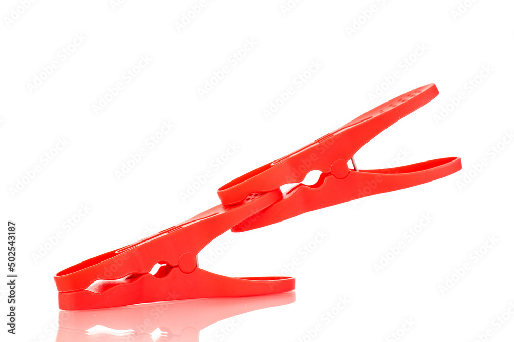 Two plastic clothespins, macro, isolated on a white background. Two plastic clothespins, macro, isolated on a white background.