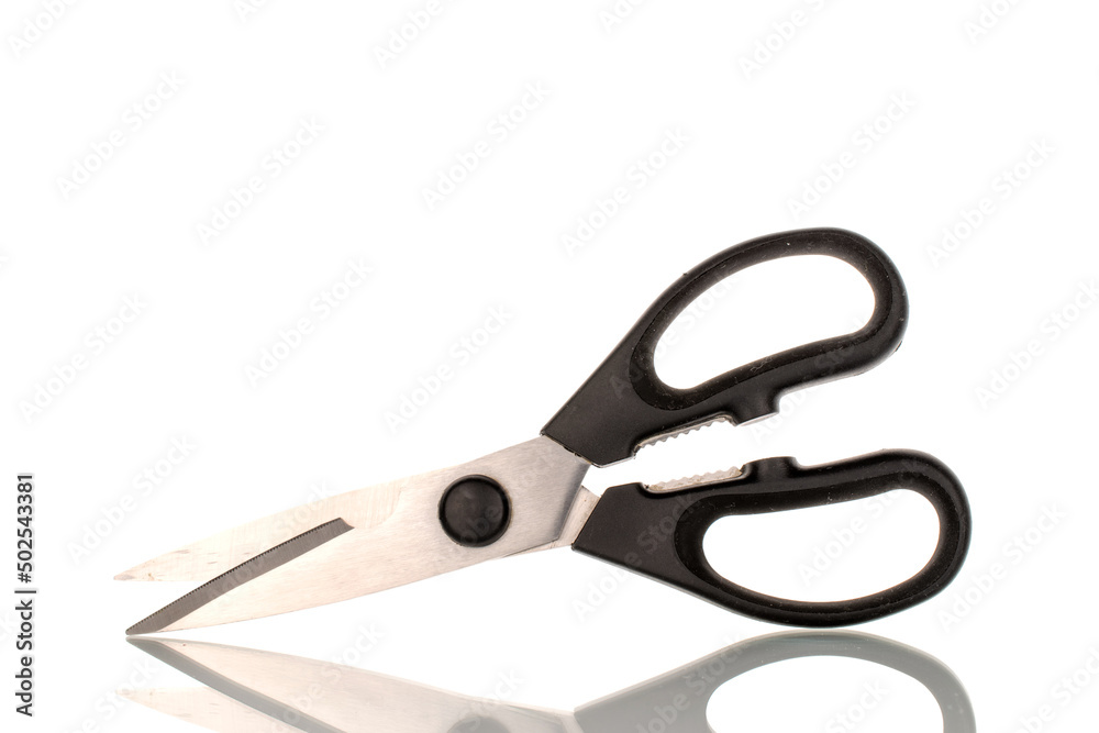 One metal scissors for the kitchen, close-up, isolated on a white background. One metal scissors for the kitchen, close-up, isolated on a white background.