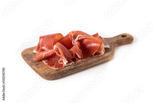 Spanish serrano ham on cutting board isolated on white background
