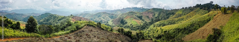 Naklejka premium Aerial view of Curvy road number 3 in the mountain of Pua district, Nan province, Thailand