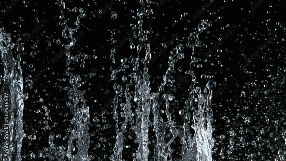 Super slow motion of water splash on black background. Filmed on high speed cinema camera, 1000 fps. Super slow motion of water splash on black background. Filmed on high speed cinema camera, 1000 fps.