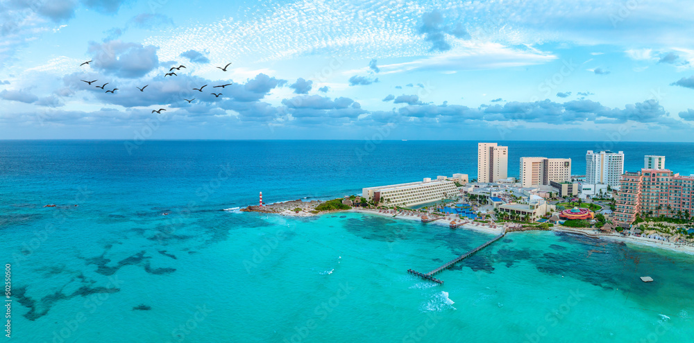 cancun resort with beach and birds