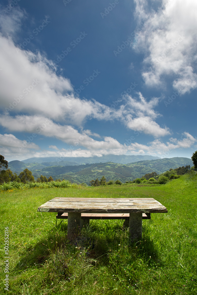picnic table with mountain view. no people. sunny day. quiet and relaxing concept. public recreation area. copy space.