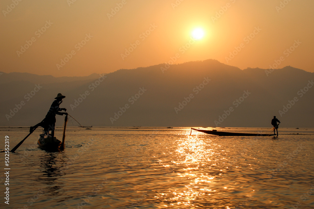  Leg-rowing fishermen at sunrise on Inle Lake Burma