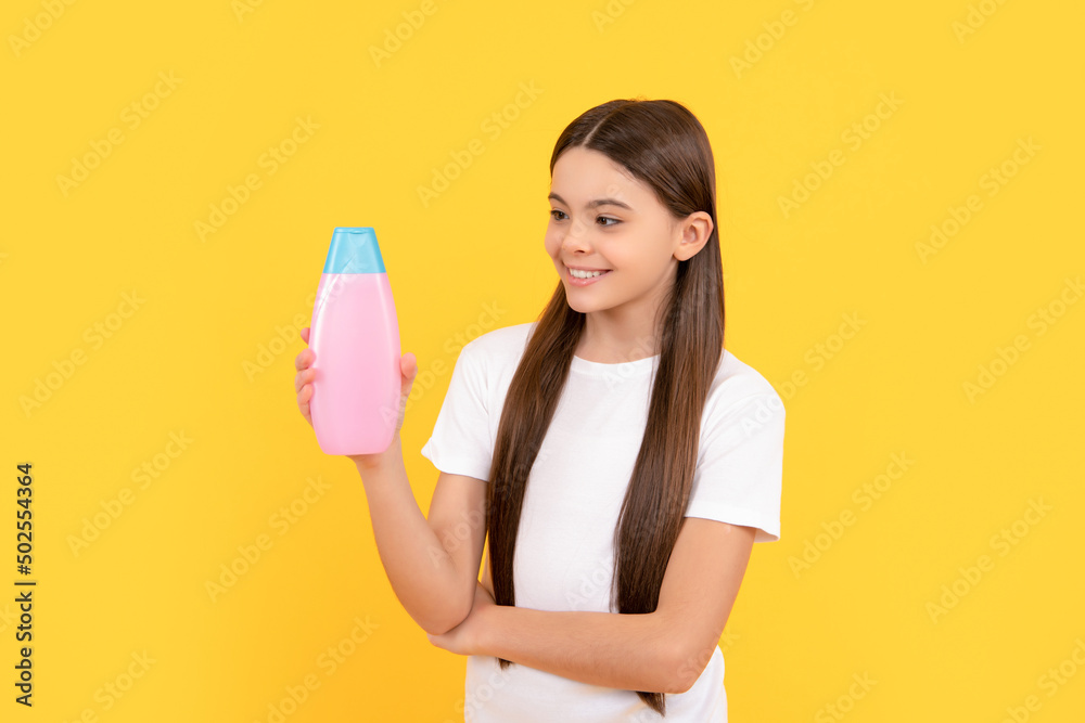 presenting cosmetic product for teen. kid use shower gel. shampooing long hair in salon. presenting cosmetic product for teen. kid use shower gel. shampooing long hair in salon.
