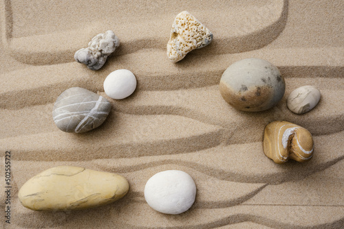 Wavy sand beach and variegated pebble stones. Zen garden
