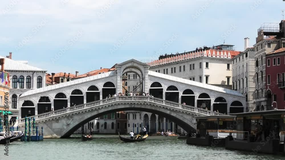 Gondolas passing the Rialto bridge in quiet Venice, Italy, wide shot Gondolas passing the Rialto bridge in quiet Venice, Italy, wide shot