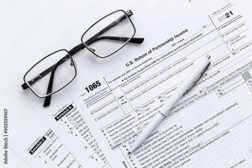 Pen on US individual tax form. Tax payment season Pen on US individual tax form. Tax payment season