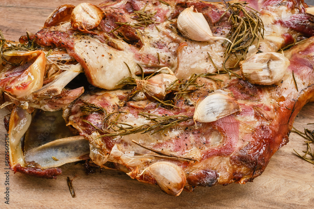 Roasted lamb shoulder with garlic, rosemary. Lamb meat, shoulder of mutton with spices. Lamb leg fillet ready to eat. Selective focus. Roasted lamb shoulder with garlic, rosemary. Lamb meat, shoulder of mutton with spices. Lamb leg fillet ready to eat. Selective focus.