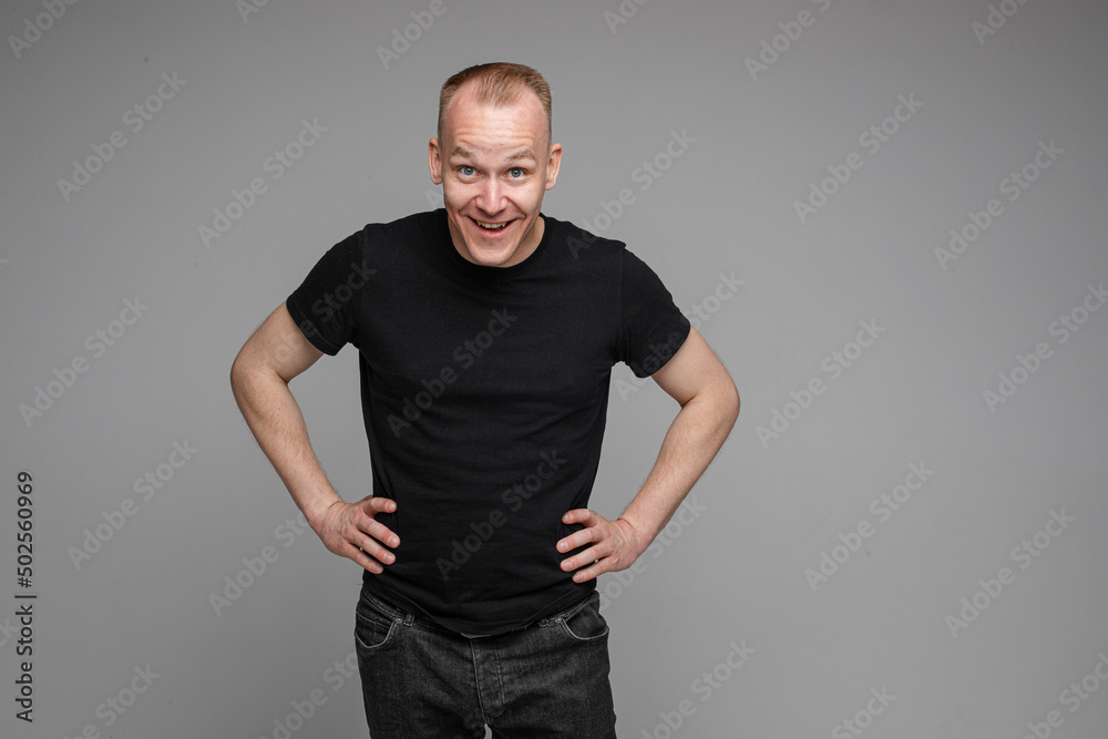 Smiling man with hands on waist. Smiling man with hands on waist.