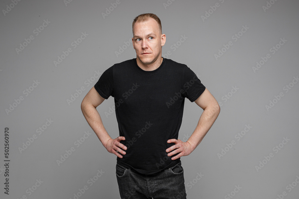 Smiling man with hands on waist. Smiling man with hands on waist.