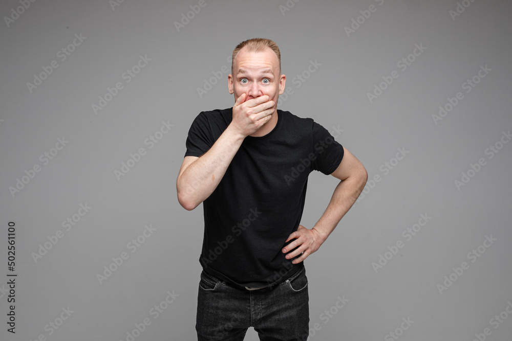 Surprised man coving mouth with hand. Surprised man coving mouth with hand.