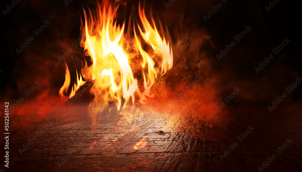 Dark abstract fire background. Flames in close-up on the background of a concrete surface. 3d illustration