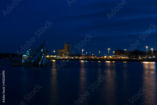 Oslo at night with sculpture She lies from Monica Bonvicini. Famous sculpture in Norway.