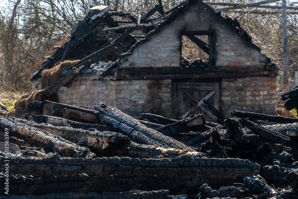 Destroyed houses in Ukraine after a shell hit. The war in Ukraine with Russia. The concept of the consequences of a missile bomb attack on a peaceful residential building.