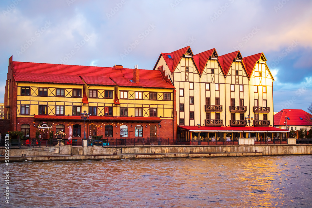 Naklejka premium Fishing village in Kaliningrad. Stylization of ancient Europe, lighthouse, ancient houses.