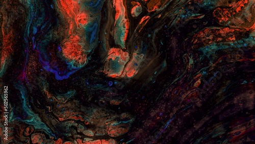 Multicolored abstract ink swirls and dark particles.