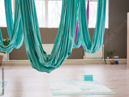 Gym with hammocks for aerial yoga.