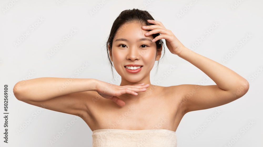 Beauty portrait of young Asian woman posing at camera