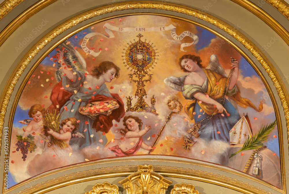 VALENCIA, SPAIN - FEBRUAR 17, 2022: The fresco of Glory of Eucharist in the church Iglesia de San Valero y San Vicente Martir by unknown artis of 20. cent.