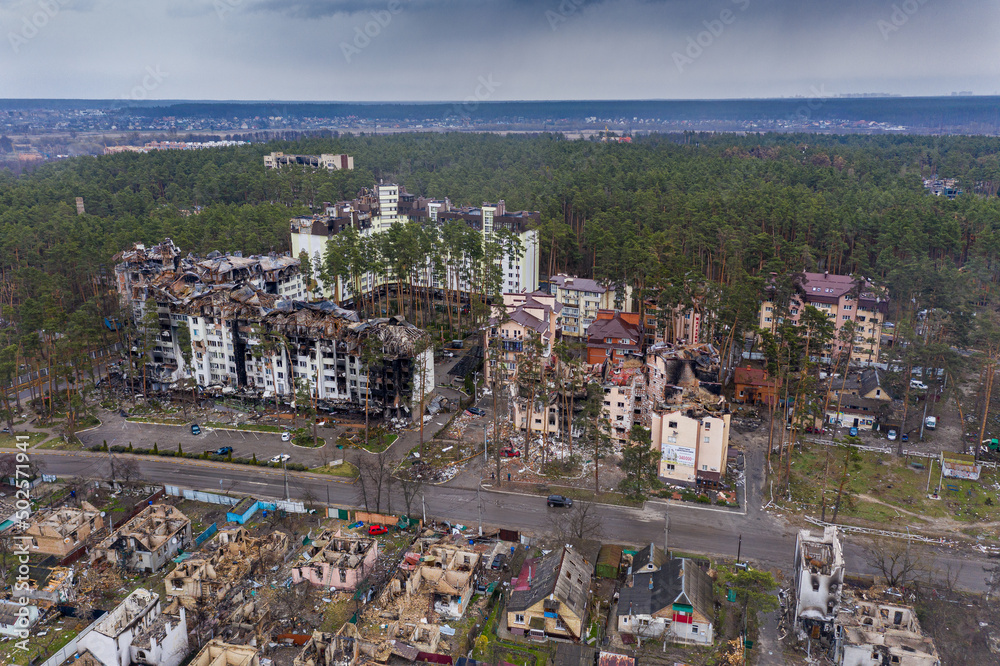 The aerial view of the destroyed and burnt buildings. The buildings were destroyed by russian rockets and mines. The Ukrainian cities after the russian occupation.