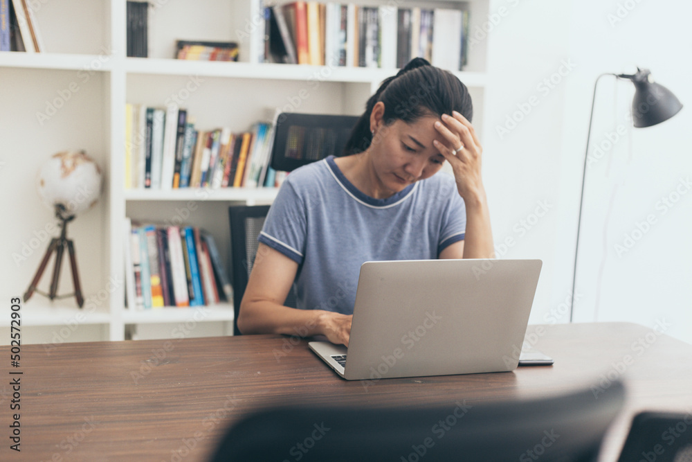 sad depression serious people from work,study stress problem.asian woman feeling tired suffering using computer working work place.concept global economic,health problems sad depression serious people from work,study stress problem.asian woman feeling tired suffering using computer working work place.concept global economic,health problems