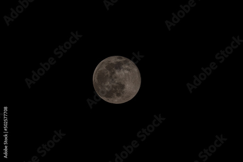 Super full moon with dark black background for placement in video  banner  shot in march 2022  Antwerp  Belgium. High quality photo
