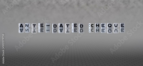 ante dated cheque word or concept represented by black and white letter cubes on a grey horizon background stretching to infinity