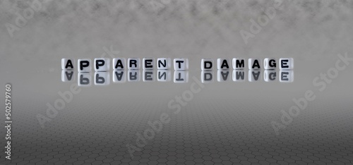 Obraz na plátně apparent damage word or concept represented by black and white letter cubes on a