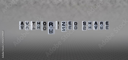 authorized share word or concept represented by black and white letter cubes on a grey horizon background stretching to infinity