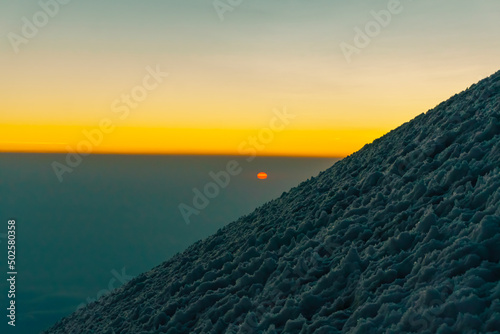 sunrise on the glacier of pico de orizaba volcano