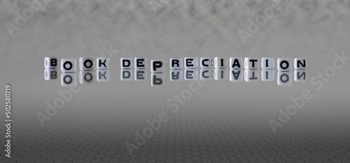 Εκτύπωση καμβά book depreciation word or concept represented by black and white letter cubes on