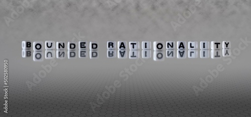 bounded rationality word or concept represented by black and white letter cubes on a grey horizon background stretching to infinity