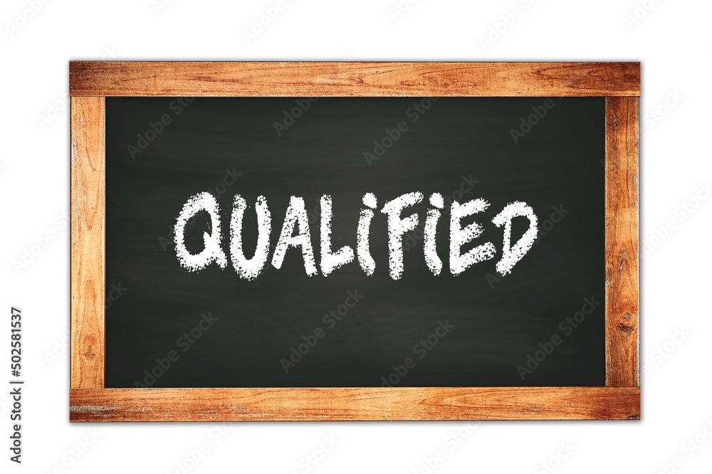 QUALIFIED text written on wooden frame school blackboard. QUALIFIED text written on wooden frame school blackboard.